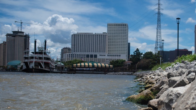 Flood waters from the Mississippi River splash against the Levees of Downtown New Orleans on Thursday. With the Mississippi River's water level at an all time high and a storm forming in the Gulf of Mexico that is expected to make landfall on the Louisiana and Texas coasts, many fear that levees will fail and that New Orleans will again be inundated as bad as it was in the 2004 aftermath of Hurricane Katrina.