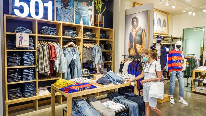 A shopper looking at jeans