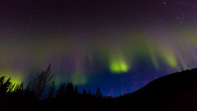 Aurora Borealis or Northern Lights illuminate the night sky from Kantishna, Alaska, Mnt. Denali National Park. (Photo by: Joe Sohm/Visions of America/Universal Images Group via Getty Images)