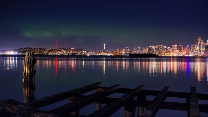 Green lights glowing above the Seattle landscape