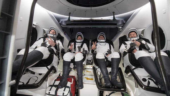 ESA (European Space Agency) astronaut Thomas Pesquet, left, NASA astronauts Megan McArthur and Shane Kimbrough, and Japan Aerospace Exploration Agency (JAXA) astronaut Aki Hoshide, right, are seen inside the SpaceX Crew Dragon Endeavour spacecraft onboard the SpaceX GO Navigator recovery ship shortly after having landed in the Gulf of Mexico off the coast of Pensacola, Florida, Monday, Nov. 8, 2021. NASA’s SpaceX Crew-2 mission is the second operational mission of the SpaceX Crew Dragon spacecraft and Falcon 9 rocket to the International Space Station as part of the agency’s Commercial Crew Program. Photo Credit: (NASA/Aubrey Gemignani)