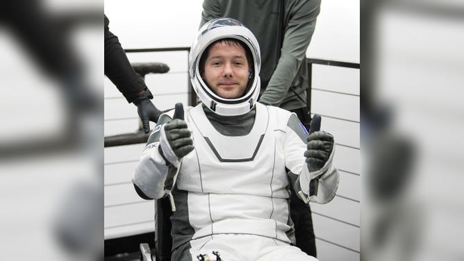 ESA (European Space Agency) astronaut Thomas Pesquet gives a thumbs up after being helped out of the SpaceX Crew Dragon Endeavour spacecraft onboard the SpaceX GO Navigator recovery ship after he and NASA astronauts Shane Kimbrough and Megan McArthur, and Japan Aerospace Exploration Agency (JAXA) astronaut Aki Hoshide landed in the Gulf of Mexico off the coast of Pensacola, Florida, Monday, Nov. 8, 2021. NASA’s SpaceX Crew-2 mission is the second operational mission of the SpaceX Crew Dragon spacecraft and Falcon 9 rocket to the International Space Station as part of the agency’s Commercial Crew Program. Photo Credit: (NASA/Aubrey Gemignani)