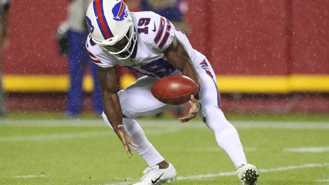 Buffalo Bills wide receiver Isaiah McKenzie bobbles a kickoff in the rain in the fourth quarter of an NFL football game between the Buffalo Bills and Kansas City Chiefs on Oct 10, 2021 at GEHA Filed at Arrowhead Stadium in Kansas City, MO.