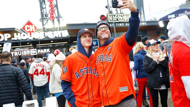 Houston Astros fans take a selfie prior to Game 3 of the World Series between the Houston Astros and the Atlanta Braves at Truist Park on October 29, 2021 in Atlanta, Georgia.