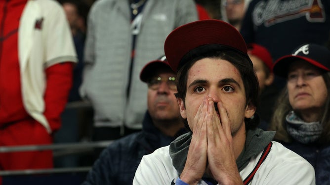An Atlanta Braves fan reacts following Houston Astros 9-5 win in Game 5 of the 2021 World Series at Truist Park.