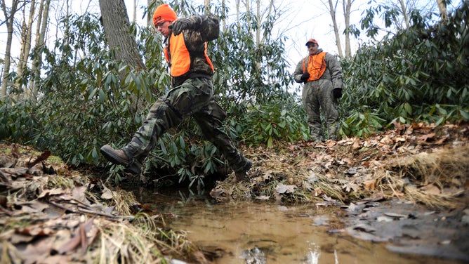 Two men on their way to a hunting spot, on he first day of deer hunting season in Pennsylvania.