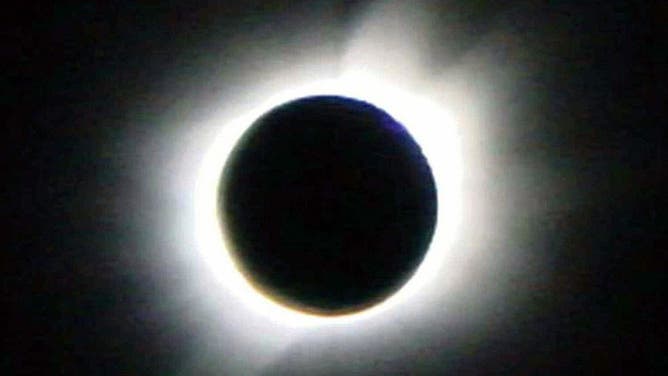 This picture released by the Japanese Antarctic observation team, 24 November 2003, shows the solar eclipse taken from the Dome Fuji, some 1,000 kilometres south of the Japanese observation base at Showa. It was visible for barely two minutes, but enthusiastic umbraphiles were happy to pay almost 9,000 USD to catch a glimpse of that rarest of solar wonders -- a total eclipse above the South Pole. AFP PHOTO/JIJI PRESS (Photo credit should read AFP/AFP via Getty Images)