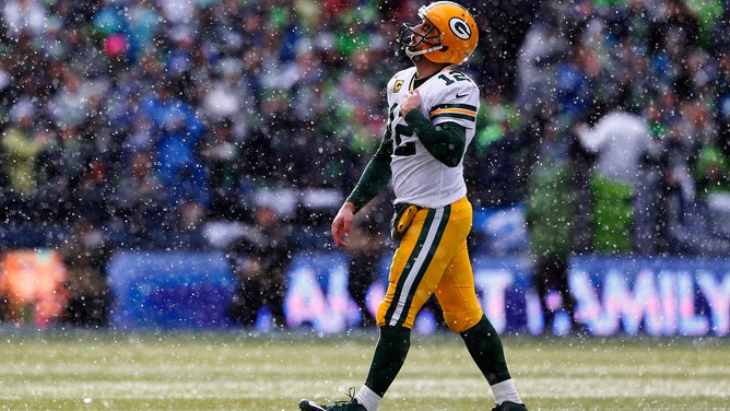 Aaron Rodgers #12 of the Green Bay Packers reacts after throwing an interception during the first half of the 2015 NFC Championship game against the Seattle Seahawks at CenturyLink Field on January 18, 2015 in Seattle, Washington.