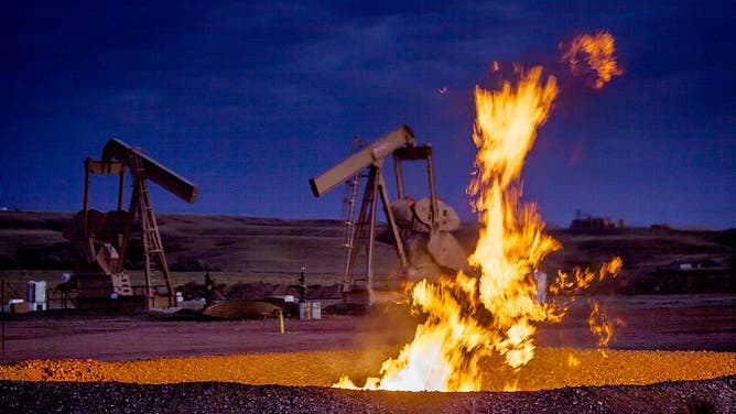 Flames from a flaring pit near a well in the Bakken Oil Field. The primary component of natural gas is methane, which is odorless when it comes directly out of the gas well. In addition to methane, natural gas typically contains other hydrocarbons such as ethane, propane, butane, and pentanes. Raw natural gas may also contain water vapor, hydrogen sulfide (H2S), carbon dioxide, helium, nitrogen, and other compounds. (Source: www.earthworksaction.org). As of July 2014, roughly 30 percent of the (Photo by Orjan F. Ellingvag/Corbis via Getty Images)
