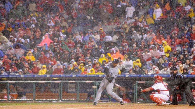 Carlos Pena #23 of the Tampa Bay Rays bats during a rain storm against the Philadelphia Phillies during Game 5 of the 2008 World Series.