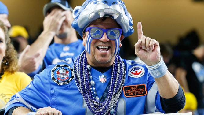 A Detroit Lions fan cheers during game between the Pittsburgh Steelers and the Detroit Lions at Ford Field in Detroit, Michigan.