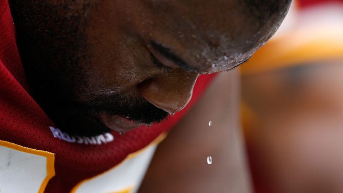 Albert Haynesworth #92 of Washington Redskins watches a drop of sweat as he waits on the bench against the Carolina Panthers at Bank of America Stadium on October 11, 2009 in Charlotte, North Carolina.