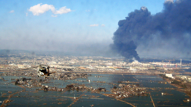 In this handout image provided by the U.S. Navy, an aerial view of tsunami and earthquake damage is seen from an SH-60B helicopter assigned to the Chargers of Helicopter Antisubmarine Squadron (HS) 14 from Naval Air Facility Atsugi on March 12, 2011, seen from the air of Sendai, Japan.