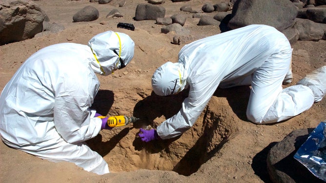 Researchers collect samples from the surface of the Atacama Desert in Chile, going a few centimeters into the ground.
