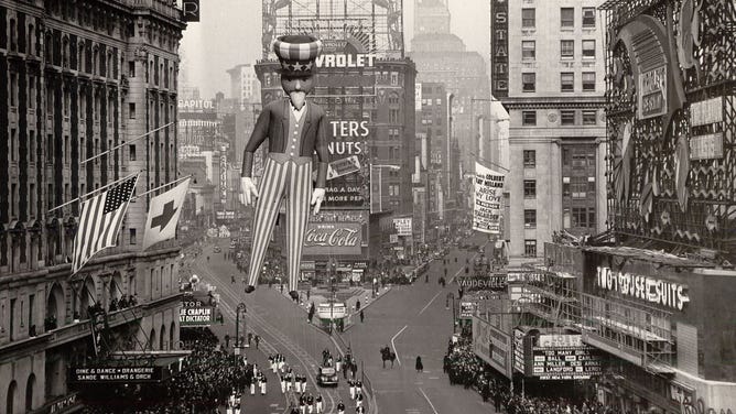 A balloon of Uncle Sam is paraded down the street during a 1940s Macy's Thanksgiving Day parade.