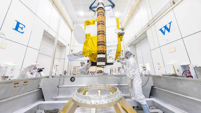 Inside a cleanroom at Johns Hopkins APL, the DART spacecraft being moved into a specialized shipping container that headed across the country to Vandenberg Space Force Base near Lompoc, California, where DART is scheduled to launch in November 2021.