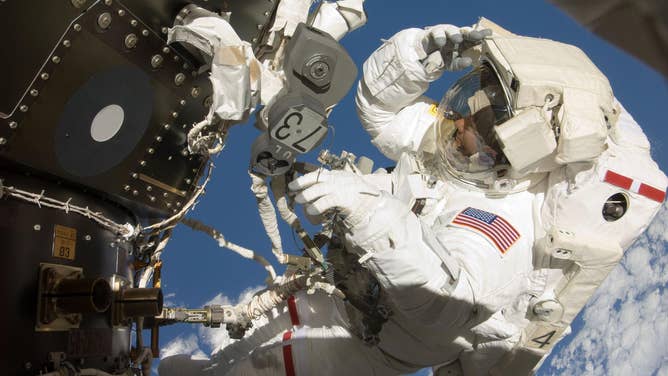 Astronaut Tom Marshburn, STS-127 mission specialist, participates in his first spacewalk and the second overall for the crew members of the Space Shuttle Endeavour and the International Space Station, July 20, 2009.