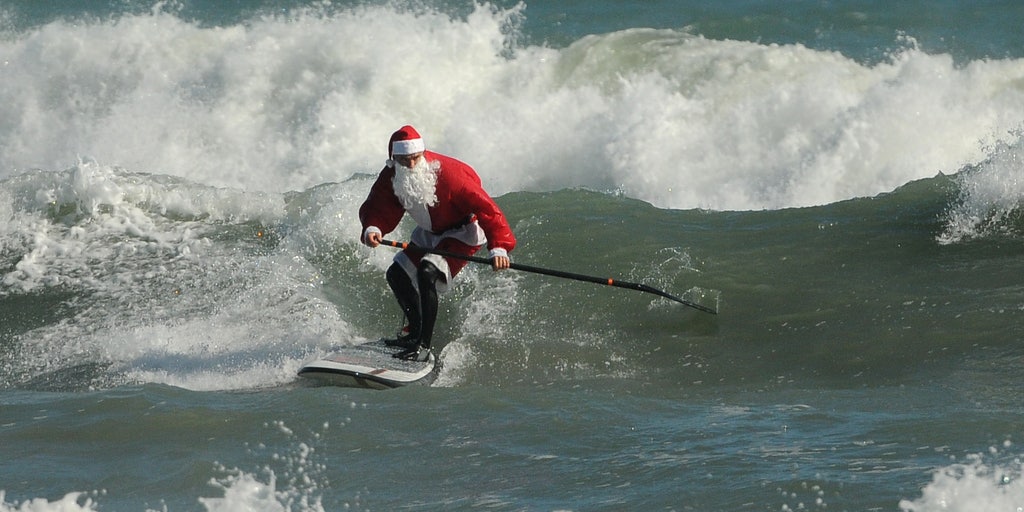 Surfing Santas ready to paddle out on Christmas Eve after pandemic ...