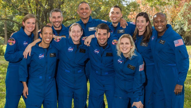 NASA announced its 2021 Astronaut Candidate Class on Dec. 6, 2021. The 10 candidates, pictured here at NASA’s Johnson Space Center in Houston are: U.S. Air Force Maj. Nichole Ayers, Christopher Williams, U.S. Marine Corps Maj. (retired.) Luke Delaney, U.S. Navy Lt. Cmdr. Jessica Wittner, U.S. Air Force Lt. Col. Anil Menon, U.S. Air Force Maj. Marcos Berríos, U.S. Navy Cmdr. Jack Hathaway, Christina Birch, U.S. Navy Lt. Deniz Burnham, and Andre Douglas. Credits: NASA