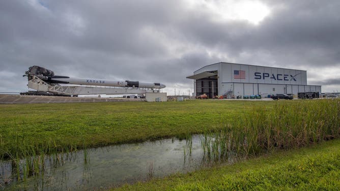 SpaceX’s Falcon 9 rocket with Dragon spacecraft rolls out to Launch Complex 39A at NASA’s Kennedy Space Center in Florida on Dec. 19, 2021, in preparation for launch.