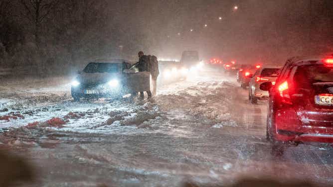 Motorists get stuck during the snowstorm in the evening in Aalborg, Denmark on December 1, 2021. - - Denmark OUT (Photo by Henning Bagger / Ritzau Scanpix / AFP) / Denmark OUT (Photo by HENNING BAGGER/Ritzau Scanpix/AFP via Getty Images)
