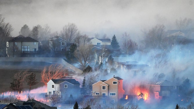 At least 2 dozen structures burned as wildfires rage outside Denver ...