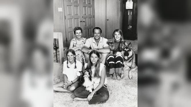 Apollo 14 Mission Commander Alan B. Shepard Jr., relaxes here with his family at home near the Houston Manned Spacecraft Center in Texas. Astronaut Shepard is sitting between his wife Louise, left, and daughter Laura, 22. Seated at front are niece Alice, 19, left, and daughter Julie 19.