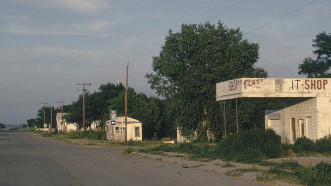 The empty main street of Texola, OK, one of the stops along Route 66 in 1989. The town was bypassed by the new Interstate 40 and suffered from the loss of through traffic.