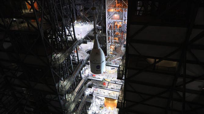The Orion spacecraft is stacked on top of the SLS inside the VAB. 