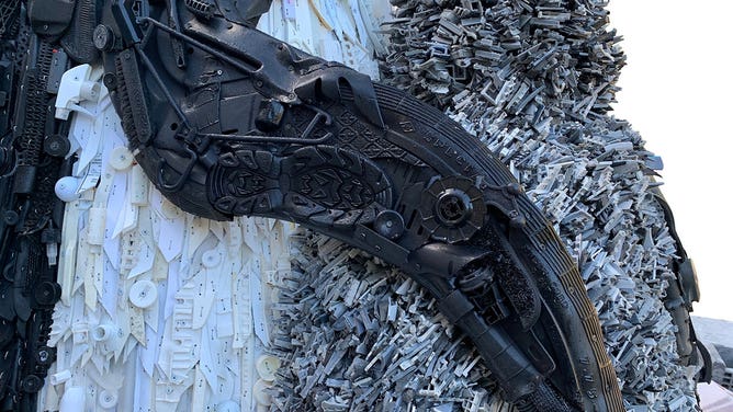 Washed ashore penguin sculpture