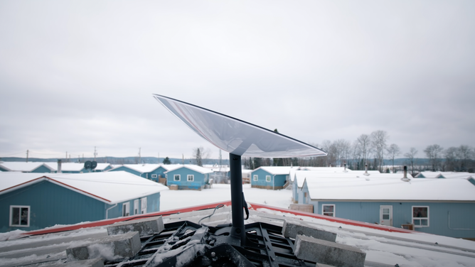 Starlink "dishy" in the snow in northwest Ontario.