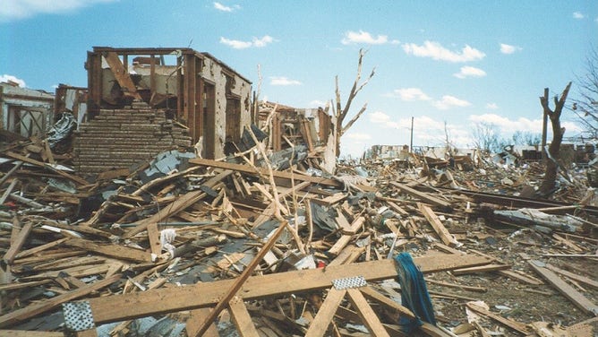 Catastrophic damage is photographed in the days following the May 3, 1999, F-5 tornado that struck Moore and Oklahoma City, Oklahoma.