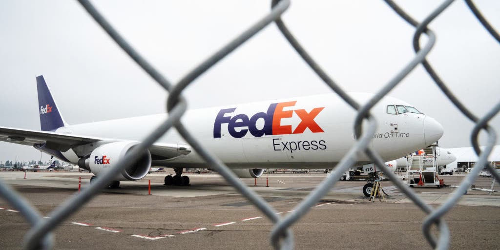 FedEx 767 slides on frozen taxiway at New Hampshire airport, strikes
