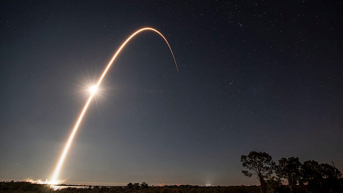 A SpaceX Falcon 9 launches from Kennedy Space Center on Jan. 18, 2022.