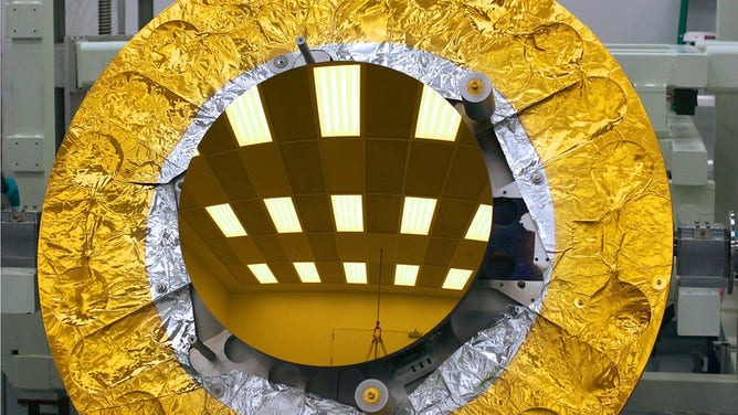 The James Webb Space Telescope secondary mirror just after gold coating at Quantum Coating Incorporated.