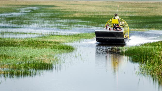 A tour boat takes tourists through Everglades National Park in Miami, Florida.