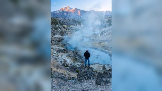 A man gazes at the Hot Creek in California's Sierra Mountains. According to the USDA Forest Service, the heat in the hot spring comes from a chamber of hot magma which lies about three miles below the surface.