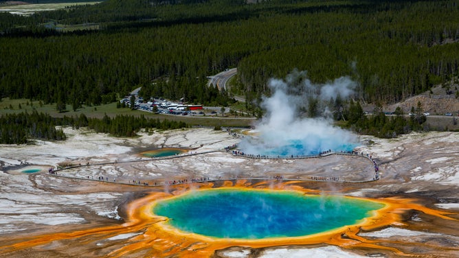 The largest hot spring in Yellowstone National Park is Grand Prismatic Spring. Its vibrant colors are caused by bacteria that can survive in the spring's extreme temperatures.