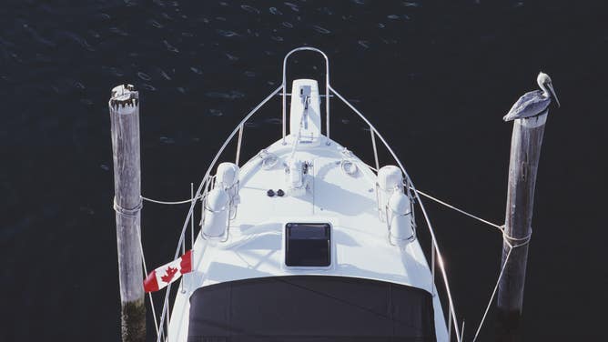 A boat flying a Canadian flag in Key Largo, Florida.