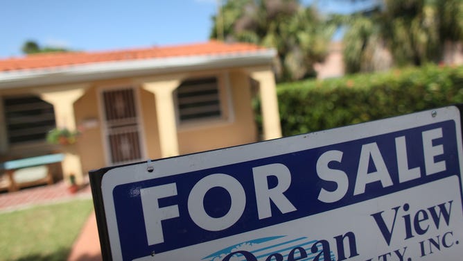 A "For Sale" in front of a home in Miami, Florida.