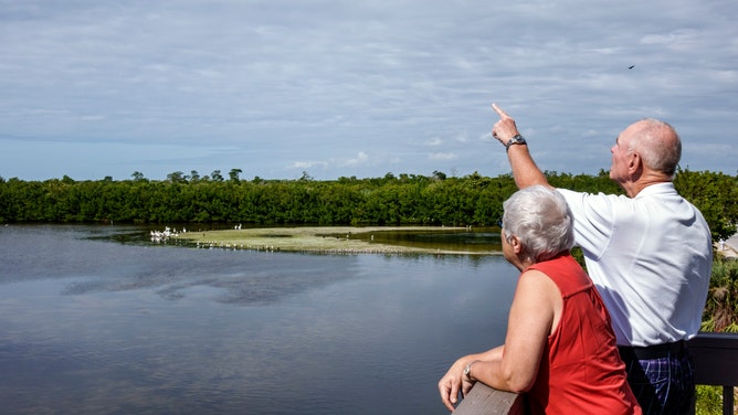 A couple enjoys the sights at Florida's J.N. "Ding" Darling National Wildlife Refuge.