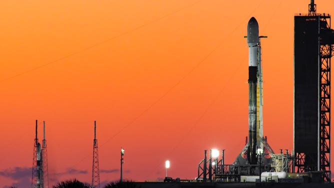 A SpaceX Falcon 9 stands tall at SLC-40 in Cape Canaveral, Florida with the COSMO-SkyMed satellite ready for launch.