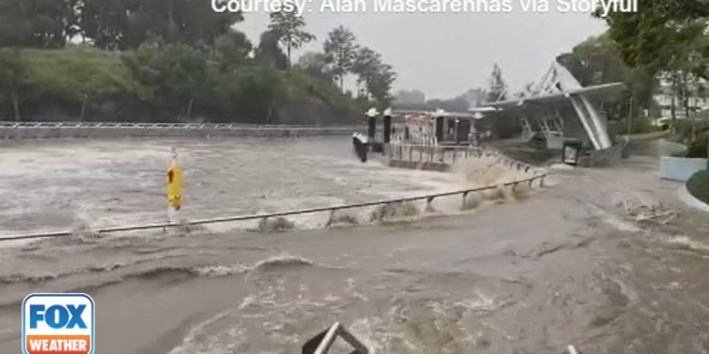 Nearly 14 inches of rain in a day floods roads, washes away jetties and ...