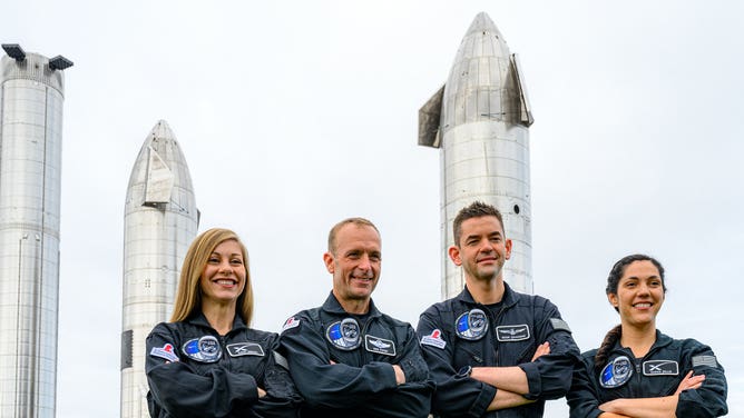 The Polaris Dawn crew in front of Starship in Boca Chica, Texas. From left to right: Anna Menon, Scott Poteet, Jared Isaacman and Sarah Gillis.