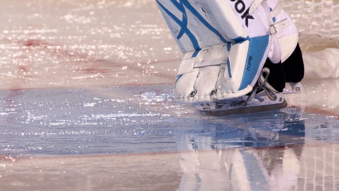Water collects on the ice from the rain at the feet of goalie Marc-Andre Fleury #29 of the Pittsburgh Penguins during the 2011 NHL Bridgestone Winter Classic at Heinz Field in Pittsburgh, Pennsylvania.