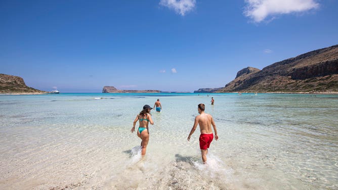 A couple enjoys the water on a sunny June day.