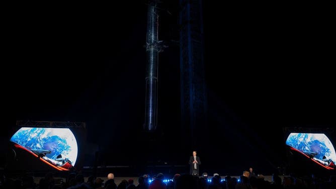 Elon Musk speaks during a press conference at SpaceX's Starbase facility near Boca Chica Village in South Texas on February 10, 2022. - Elon Musk delivered updates on SpaceX's efforts to develop its interplanetary Starship rocket, but stopped short of announcing a firm launch date for an orbital test or new missions, despite considerable buildup ahead of the rare presentation. (Photo by JIM WATSON / AFP) (Photo by JIM WATSON/AFP via Getty Images)