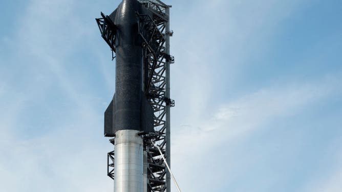 SpaceX's first orbital Starship SN20 is stacked atop its massive Super Heavy Booster 4 at the company's Starbase facility near Boca Chica Village in South Texas on February 10, 2022. - Elon Musk's SpaceX has reassembled the world's tallest rocket ahead of a highly anticipated update on the company's Starship program in South Texas. (Photo by JIM WATSON / AFP) (Photo by JIM WATSON/AFP via Getty Images)