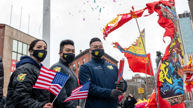 Members of the FDNY celebrate Lunar New Year in NYC's Chinatown.