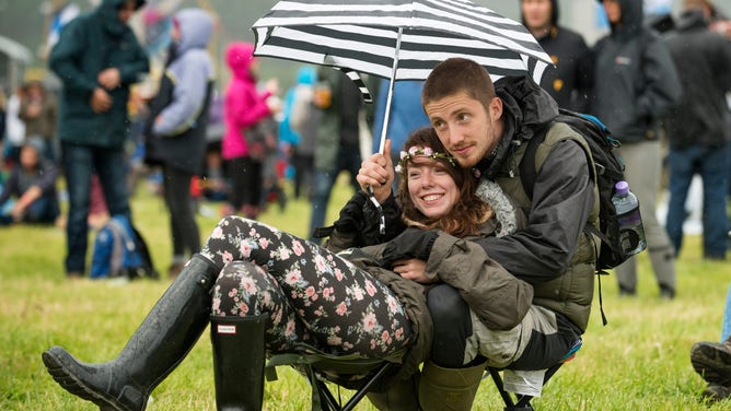 Festival goers in the rain.